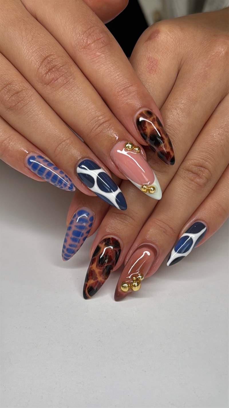 Tortoiseshell and blue abstract almond nails