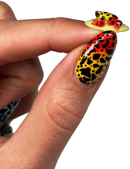 Glossy almond nails in a red, orange and black leopard print