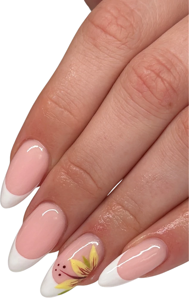 White French tip nails with a delicate gold leaf accent