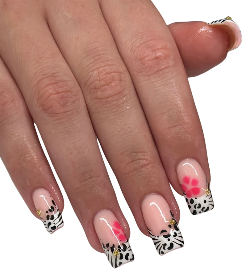 Animal-print French tips with pink flowers and gold charms