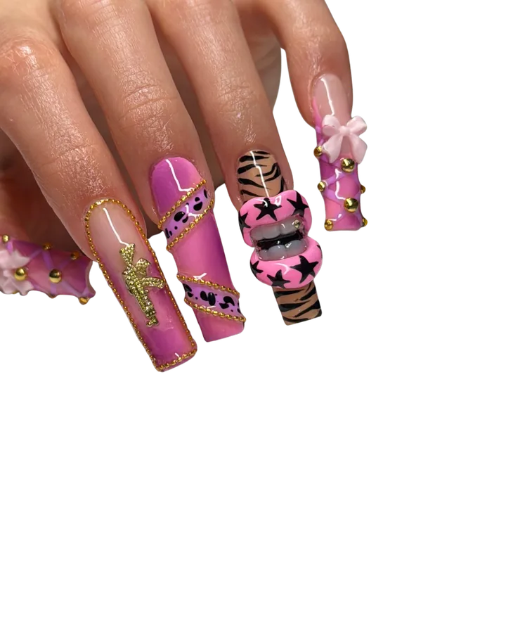 Bold pink chrome nails with gold chains and a 3D bow